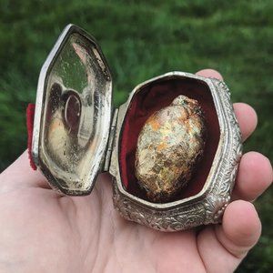 Gilded opossums heart in vintage jewelry casket box